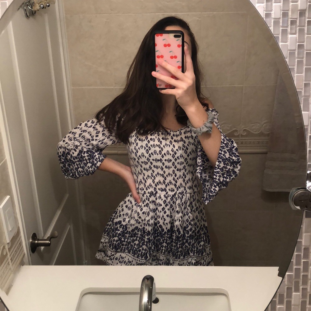 A blue and white long sleeve romper.